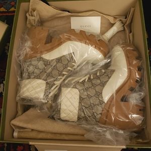 Gucci Monogram Ebony combat boots recently listed on TheRealReal